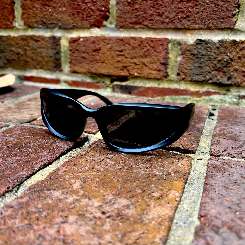 Black Balenciaga like sunglasses